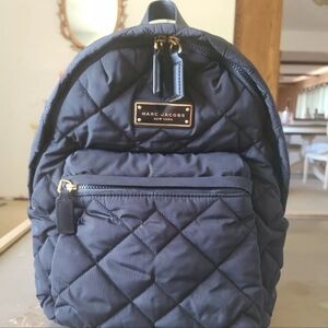 Marc Jacobs quilted black medium backpack.